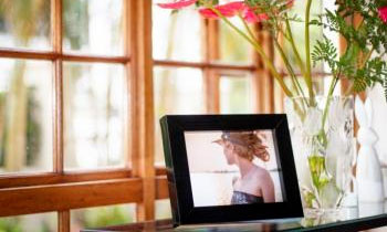 The Desktop photo frame in front of a window