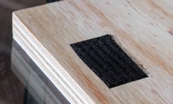 Faceblock with naturally laminated timber sides